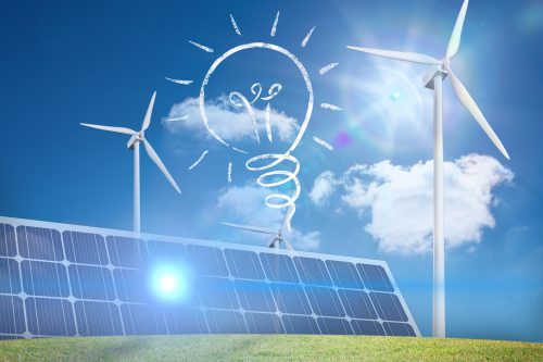 composite of solar panel and wind turbine graphic on green field background with lightbulb